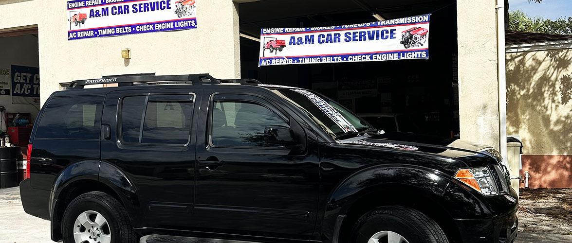 black car out of auto repair shop